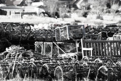 Lobster pots on a beach, B&W