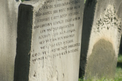 A headstone in a cemetary