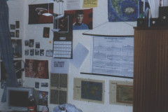 an eclectic set of posters on a wall